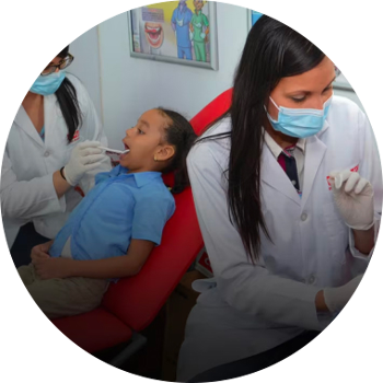 Dentist looking in a microscope